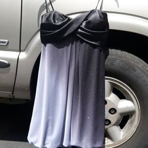 I am selling a black fancy XSCAPE  dress.